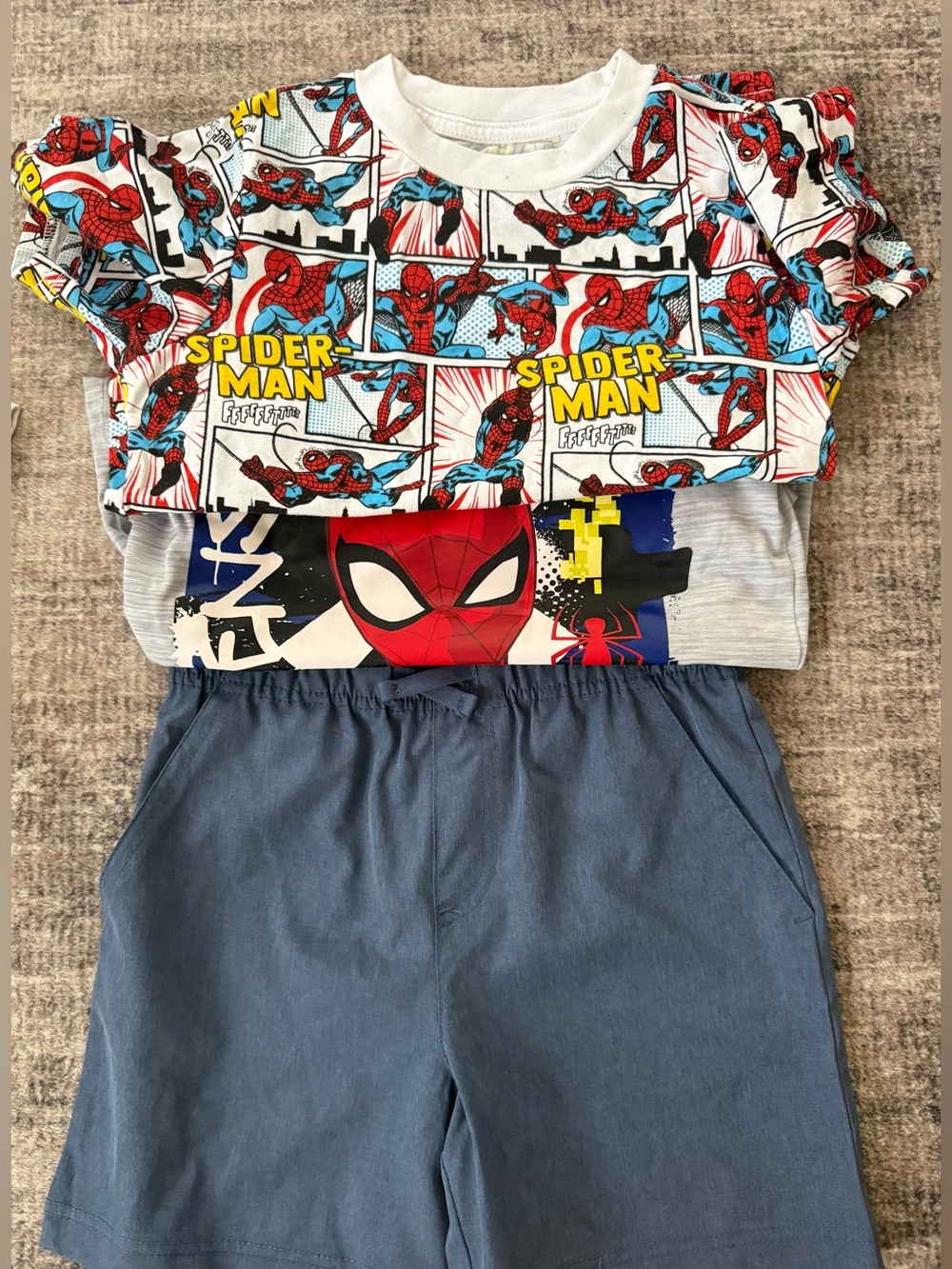 Spiderman shirt and grey shorts